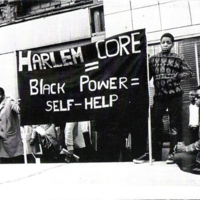 a photo of a Harlem CORE Black Power banner outside of Harlem CORE headquarters