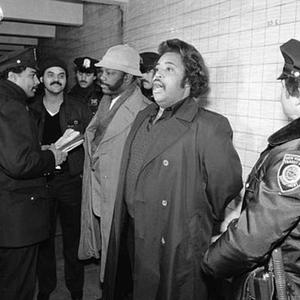 photo of Harlem CORE chairmen Cyril Boynes, Jr. and George Holmes being arrested with Rev. Al Sharpton